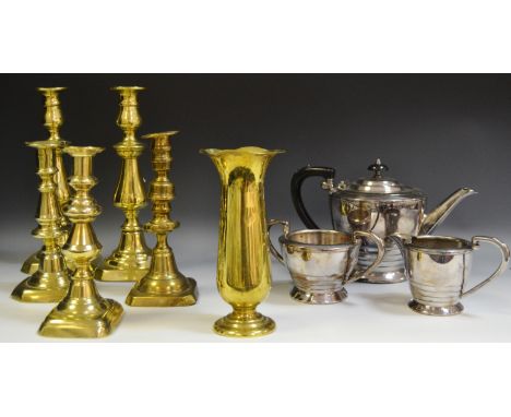 Metalware - a three piece chrome plated tea service; a pair of large brass candlesticks; a pair of George III style candlesti