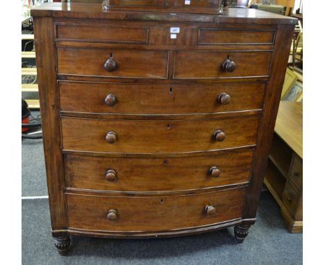 A George III mahogany bow fronted chest  of two blind above two short cockbeaded drawers, four long cockbeaded drawers