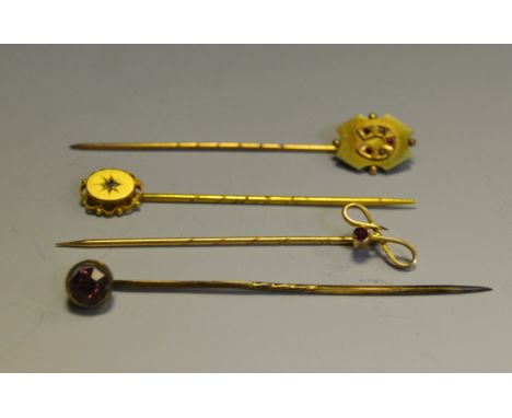 a 15ct gold stick pin; another 9ct set with Rubies and seed pearl; another 9ct; etc (4)