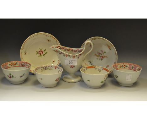 A Newhall ovoid teapot and cover, decorated with the Famille Rose palette with floral sprigs, banded with scrolling foliage, 
