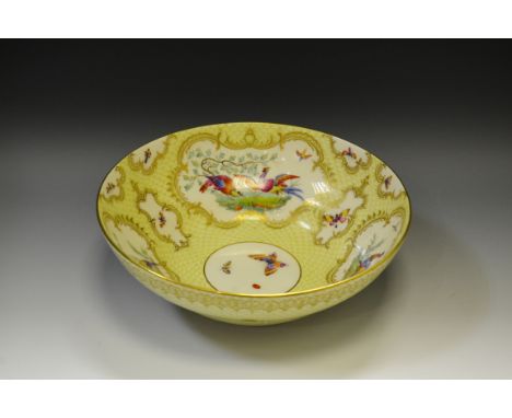 A Royal Worcester ogee shaped bowl, painted by John Freeman, signed,  with alternating vase and fan shaped reserves with fanc