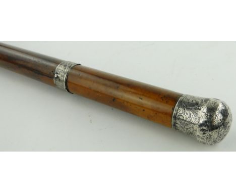 A sword stick 
with engraved white metal mounts, 31".