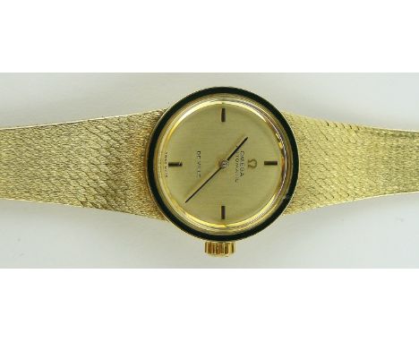 A lady's 18ct gold Omega DeVille automatic wristwatch,
green enamel bezel with 18ct woven strap, case width 24mm, gross weigh
