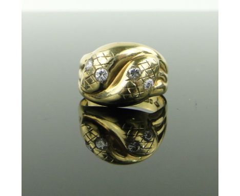 9ct gold snake ring
with diamond set eyes, size R.