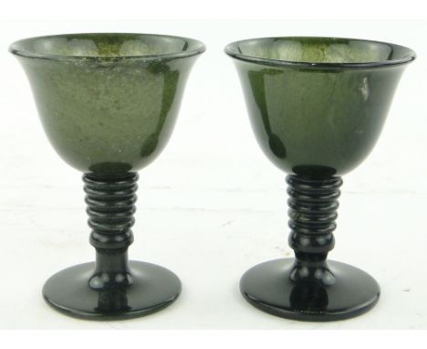 A pair of Chinese spinach jade goblets, 
height 3.5".