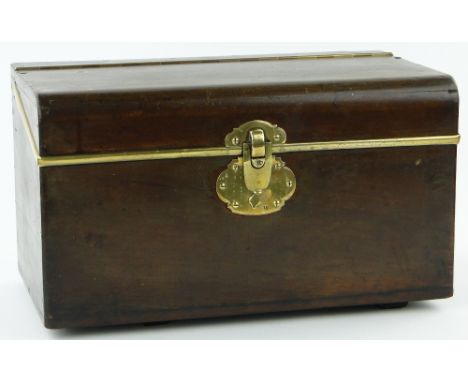 A small mahogany dome-top travelling trunk
with brass mounts, possibly for a car, length 17.75".