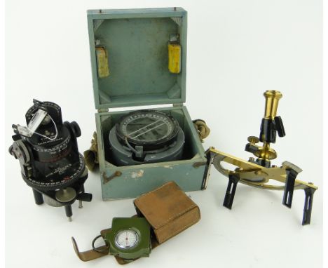 A boxed naval compass,
leather cased military pocket altometer, a military Astro compass and another, (4).