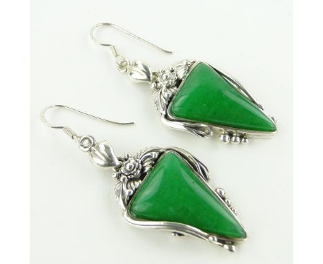 A pair of silver and jade pendant earrings,
length excluding bale 35mm.