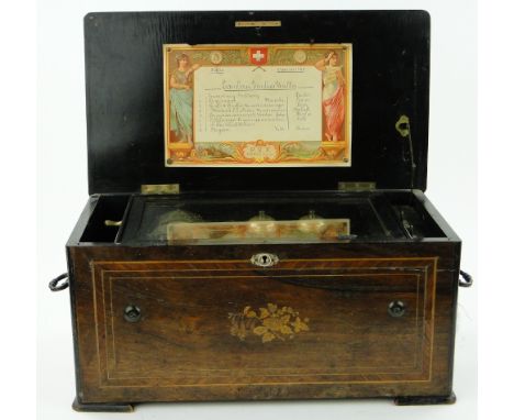 An Antique Swiss musical box
with inlaid floral decoration, playing 8 airs by P V F St. Croix, Switzerland, a/f, case length 