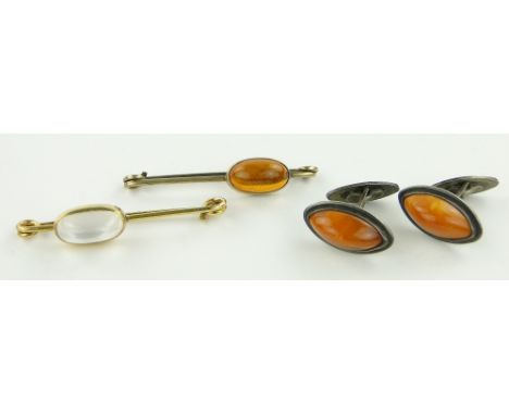 Pair of amber and silver cufflinks, 
and 2 other stone set brooches.