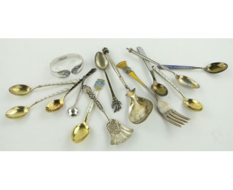 Quantity of silver and enamel spoons and forks, etc (14).