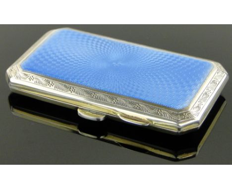 A silver and blue enamel cigarette case,
Birmingham 1927, height 8.5cm.