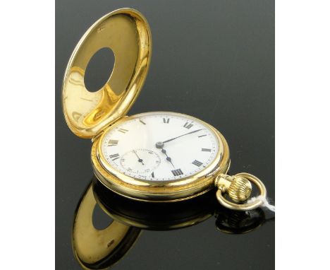 An 18ct gold half hunter pocket watch circa 1930,
topwind with enamel dial, case width 48mm.