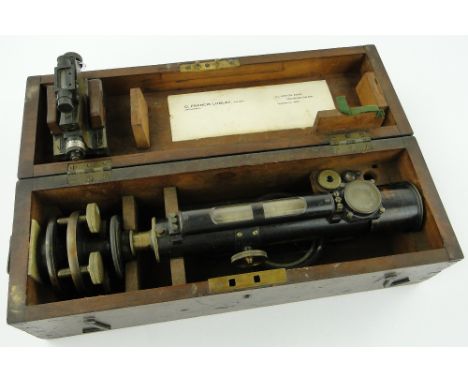 A brass theodolite
with mount by A Abraham, Liverpool, in mahogany case, length 16.75" and a brass tool with spirit level mar