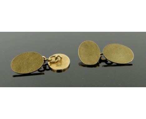 Pair of 9ct gold plain oval cufflinks, 
8.8 gm.