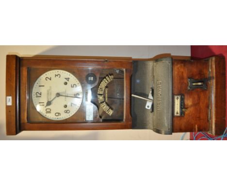 A National Time Recorder co oak cased clocking-in machine, no. 87735,
height 3'3".