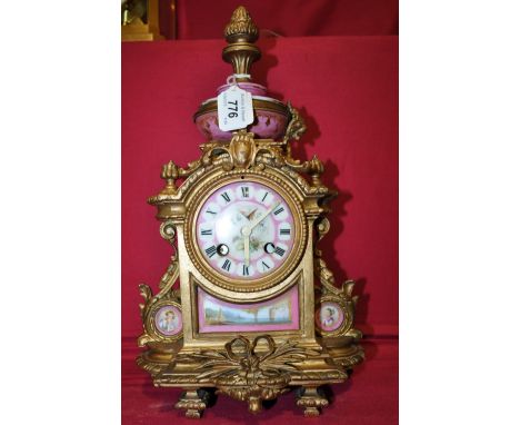 A French gilt metal mantel clock,
with ceramic panels, height 14.5".
