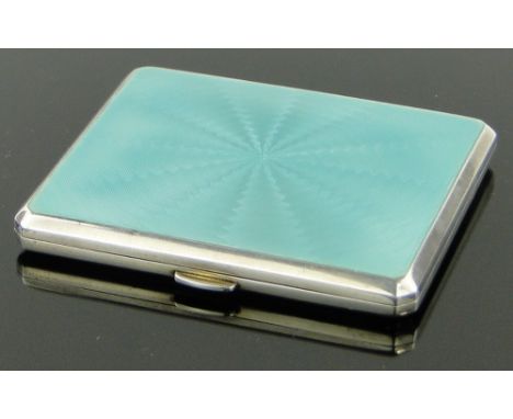 An Art Deco silver and turquoise enamel cigarette case,
makers marks B & Co., Birmingham 1930, height 8cm.