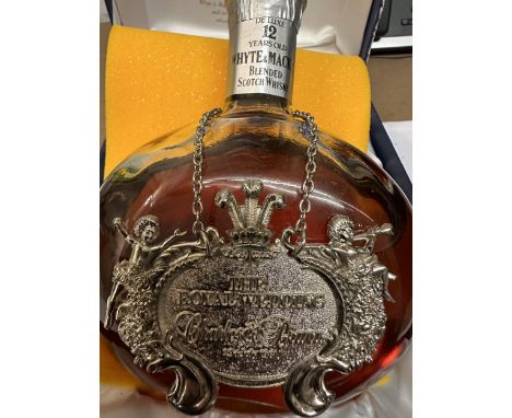 A single boxed bottle of Whyte & Mackay blended Scotch Whisky De luxe 12 year old. commemorating the marriage of the Prince o