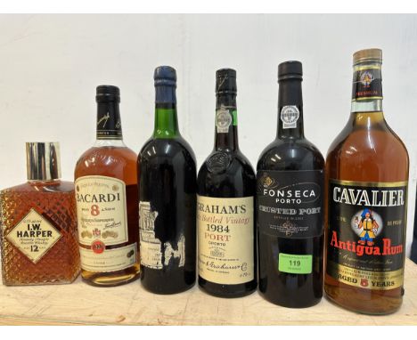 One bottle of Fronseca Crusted Port 2001, one bottle Berry Brothers Vintage Port 1963 (label partly lost), one bottle Graham'