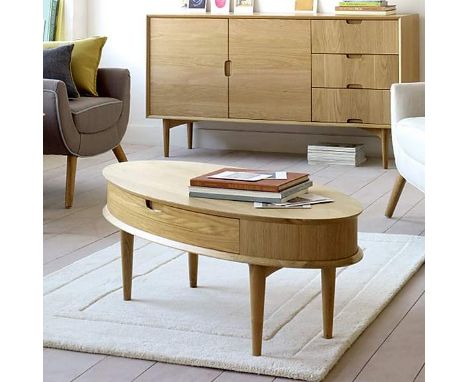 Norse  Oak Coffee Table with Drawer Crafted from solid oak wood and light oak veneer, this easy to assemble oval coffee table