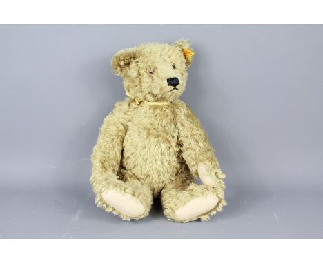 A 20th Century Steiff Mohair Growler Bear. The bear having a stitched nose with glass eyes and felt pads.