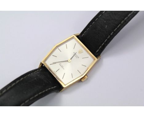 A Lady's Vintage 18ct Yellow Gold Cellini Rolex Wrist Watch. The watch having a silvered dial with baton numerals on a black 