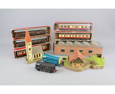 Large Quantity of Vintage Trix Twin Toy Railway. This lot contained in five boxes comprises the following: LMS Locomotive 712