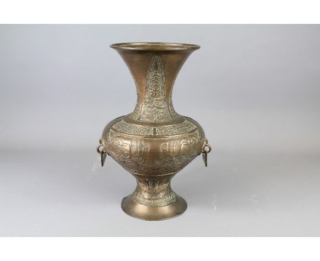 Antique Chinese Bronze Vase. The vase with flared rim with acanthus leaf design, archaic-style decoration with taotie masks a