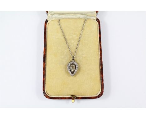 Antique 18ct White Gold and Diamond Pendant Necklace. The central tear drop diamond approx 7 x 5 x 3mm 75 pts, surrounded wit