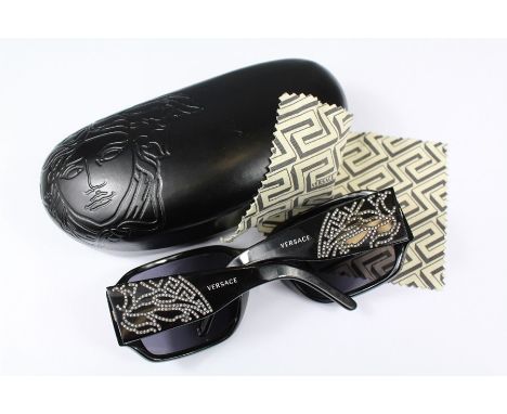 A Pair of Versace Sunglasses. The sunglasses in the original case, model nr 4110B.