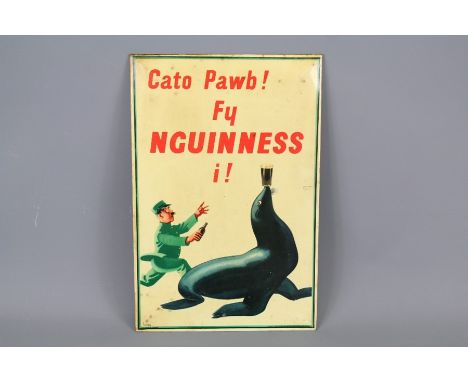 A Vintage Welsh Guinness Show Card. The sign depicting a zoo-keeper and seal with the following expression "Cato Pawb Fy nGui