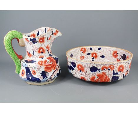 Mason's Ironstone Basin and Jug. The set decorated in blue and orange floral pattern, with serpent handle, the jug approx 24 
