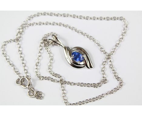 A 9ct White Gold Sapphire Pendant and Chain. The sapphire approx 6 x 4 mm, approx 3.60 gms.