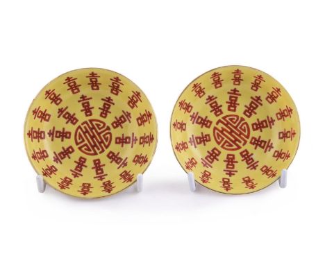 A pair of Chinese famille rose 'Marriage' saucers, mark of Tongzhi and of the period (1862-1874), the interior painted with a
