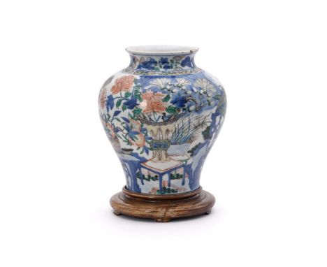 A Chinese Wucai vase, Shunzhi Period (1644-1661), in underglaze blue and painted with colourful enamels and iron-red with fru
