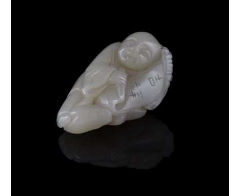 A Chinese pale celadon jade 'Boy' pendant, the pebble carved in the round as a boy riding on a toad, his hands holding a scro