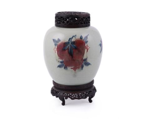 A Chinese underglaze blue and copper-red 'Three Abundances' ginger jar, Kangxi, painted with three clusters of fruit and foli