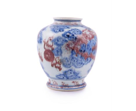 A Chinese copper-red and underglaze blue 'dragon' vase, Qianlong, painted with two dragons chasing the flaring pearl amongst 