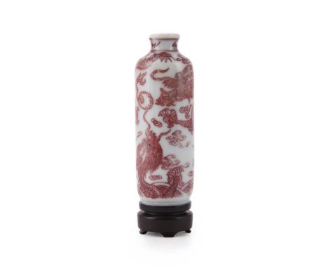 A Chinese red-glazed 'dragon' snuff bottle, Duoguang, of cylindrical form with a dragon chasing a flaming pearl, the eyes dot