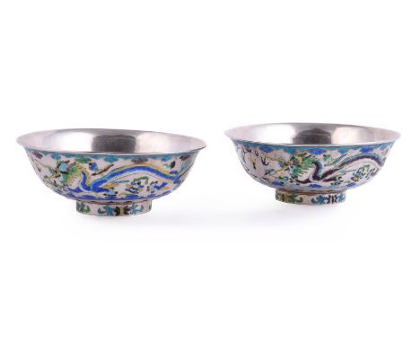 A good pair of Chinese silver and enamel 'Dragon' bowls, Qing Dynasty, late 19th or early 20th century, the exterior with two