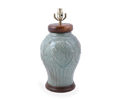 A Chinese longquan celadon vase, Yuan Dynasty (1279-1368), the body applied with moulded meandering stems bearing peony bloss