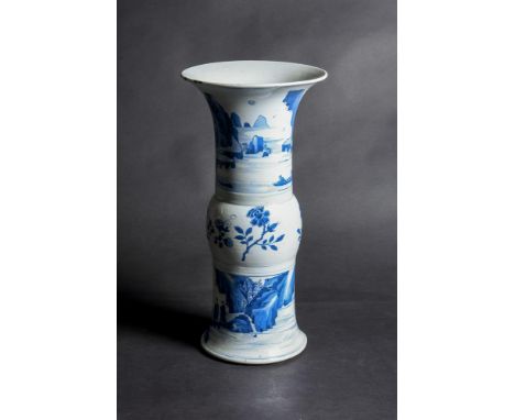 A Chinese blue and white gu-form vase, Kangxi, the body and neck painted in various shades of cobalt-blue around the exterior