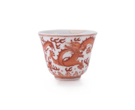A Chinese iron-red 'Dragon' cup, Tongzhi mark and of the Period, with bell-shaped sides rising from a slightly tapered low fo