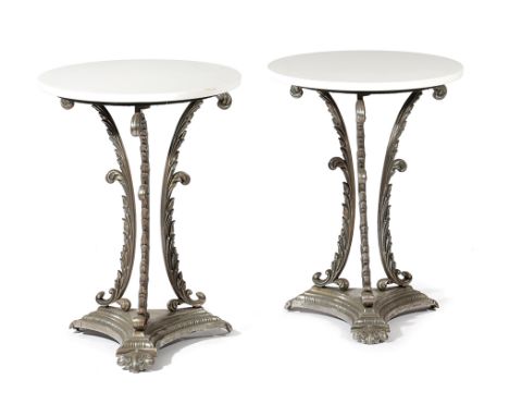 A PAIR OF CAST IRON OCCASIONAL TABLES each with a later circular top, on tripod leaf supports and triform base (2) 68.2cm hig