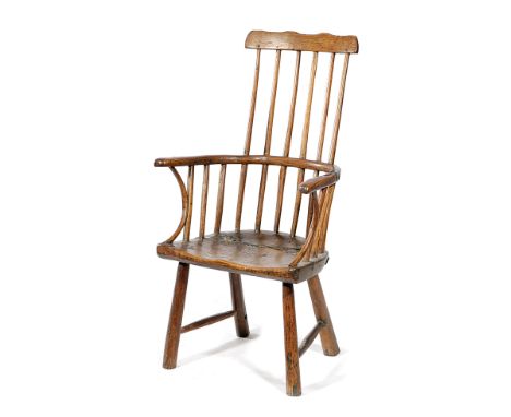 A FOLK ART PRIMITIVE ASH AND ELM CHILD'S WINDSOR ARMCHAIR PROBABLY WELSH, LATE 18TH / EARLY 19TH CENTURY with a shaped comb a