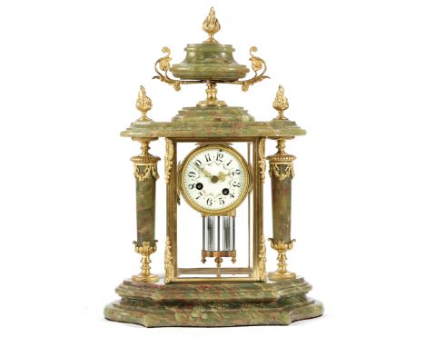 A FRENCH ONYX AND ORMOLU MANTEL CLOCK LATE 19TH / EARLY 20TH CENTURY the brass eight day drum movement striking on a bell, wi