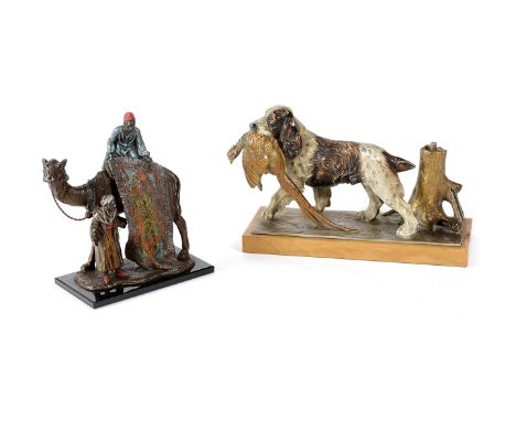 TWO AUSTRIAN COLD PAINTED METAL TABLE LIGHTERS FIRST HALF 20TH CENTURY one in the form of a spaniel with a pheasant in its mo