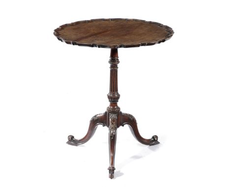 AN EARLY GEORGE III MAHOGANY TRIPOD TABLE C.1760 the circular tilt-top with a moulded pie-crust edge, above a fluted stem, th