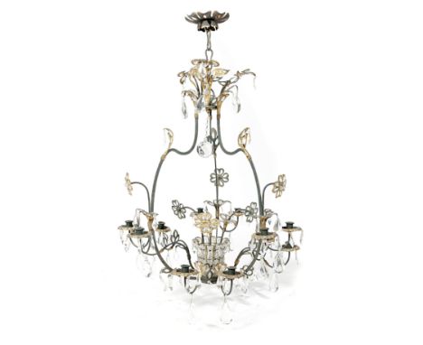 A FRENCH GILT AND EBONISED METAL TWELVE-LIGHT CHANDELIER IN THE MANNER OF MAISON JANSEN, C.1940 of open form, with scrolling 